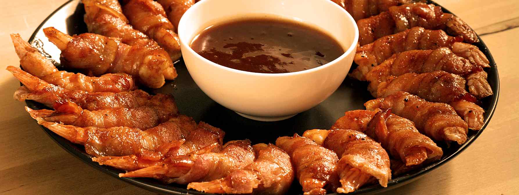 Bacon wrapped shrimp plate on the table