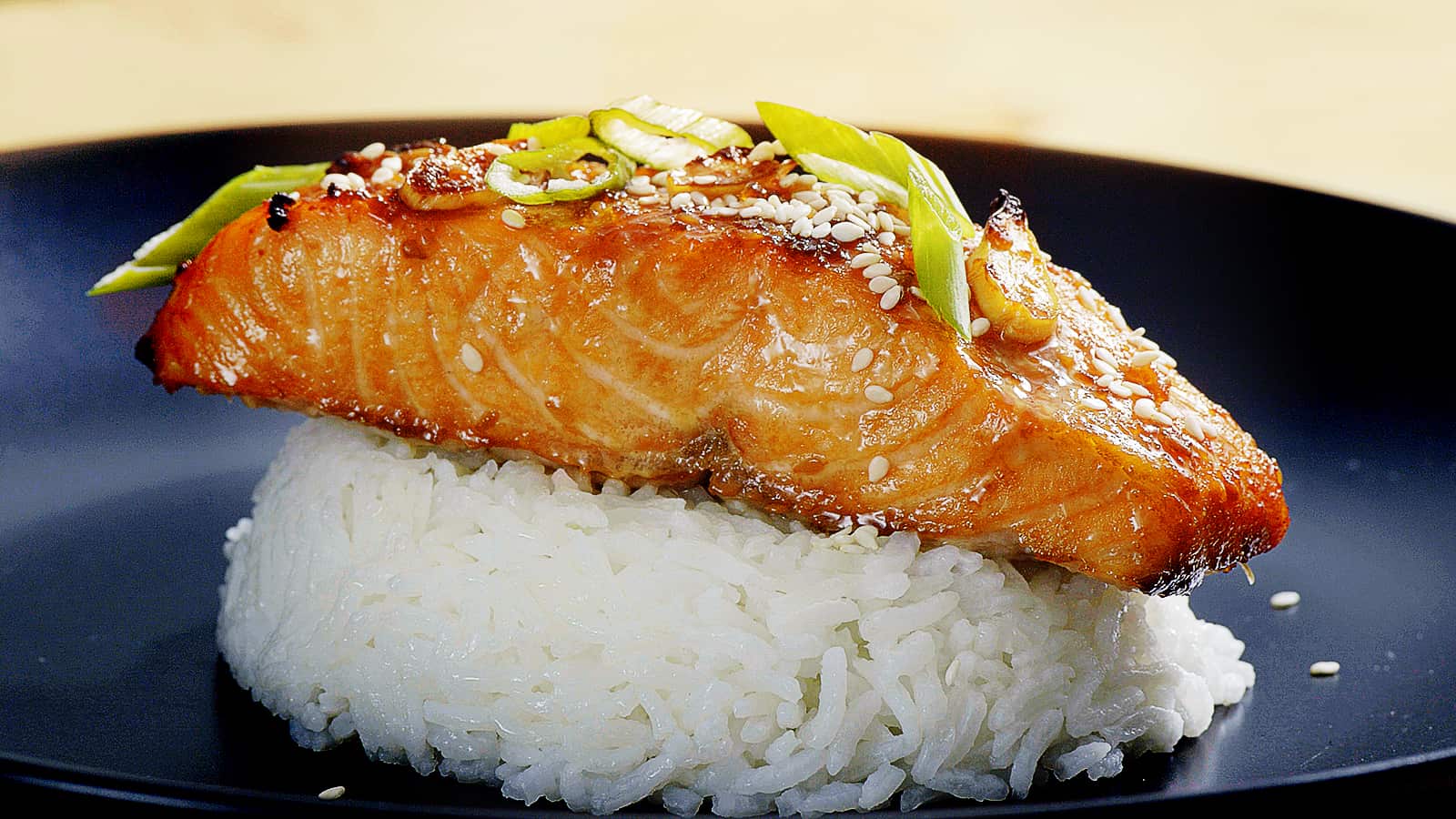 Teriyaki Salmon on the mound of rice after being cooked in the toaster oven