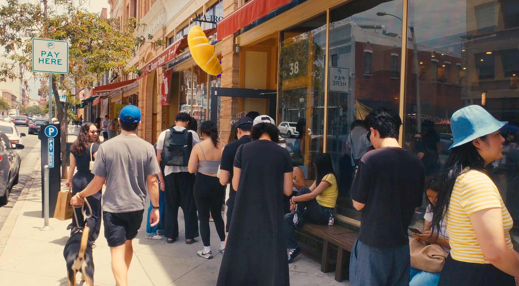 Customers waiting outside WA-IRO Japanese Bakery & Cafe in Pasadena, where freshly baked shio pan draws weekend lines.